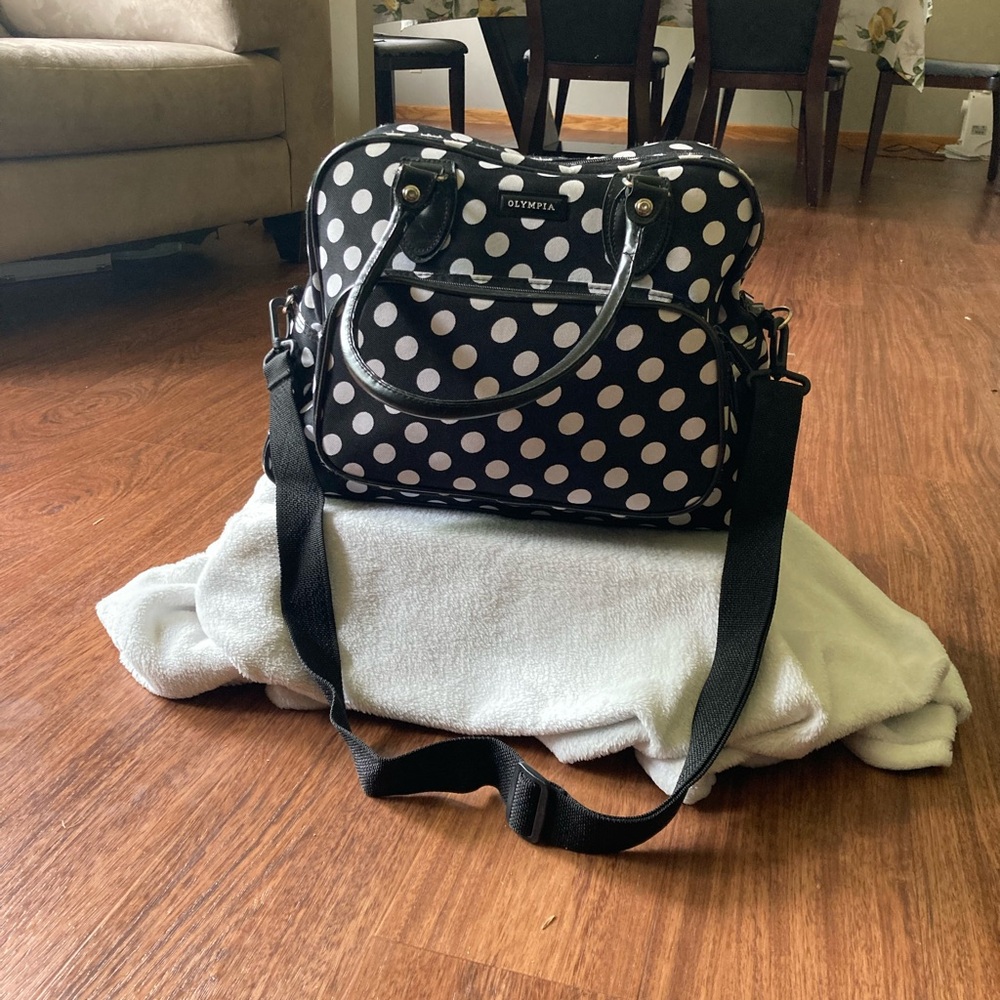 A polkadot bag for clothes to travel.